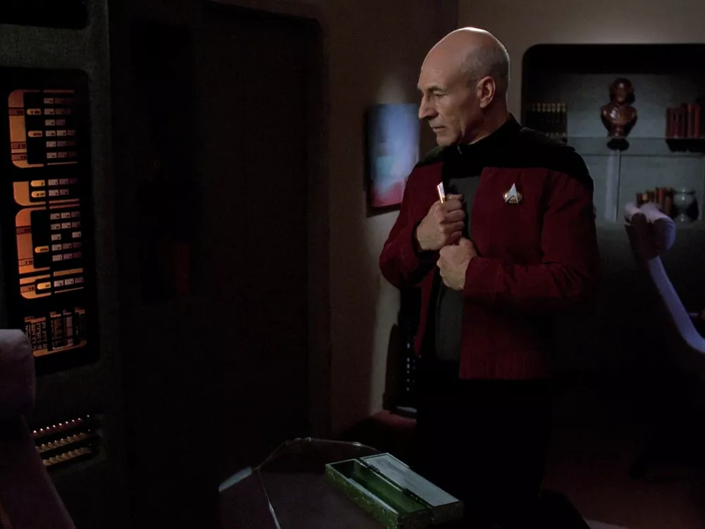 Picard holds his cherished Ressikan flute